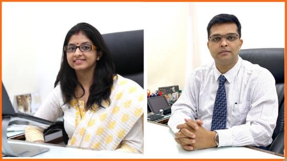 PaisaDukan Founders Rajiv M. Ranjan & Neeta Ranjan on their office desk